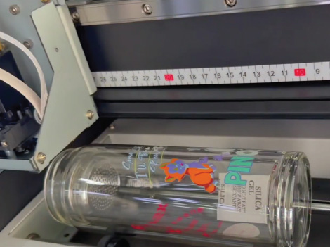 UV-A3 bottle printing in progress